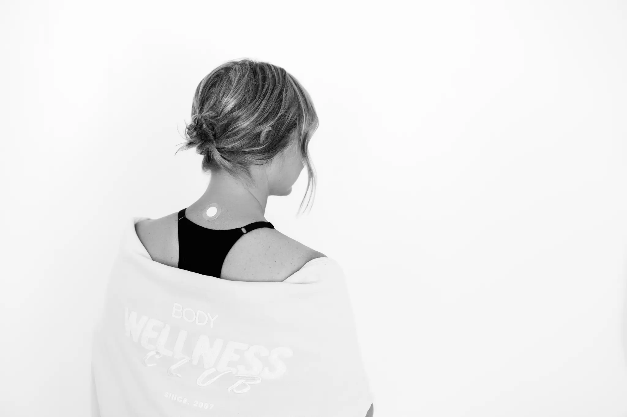 LifeWave phototherapy patch worn on acupressure point on the neck